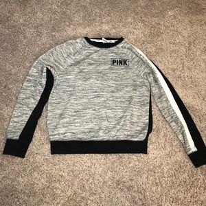 A Victoria’s Secret pink sweatshirt
